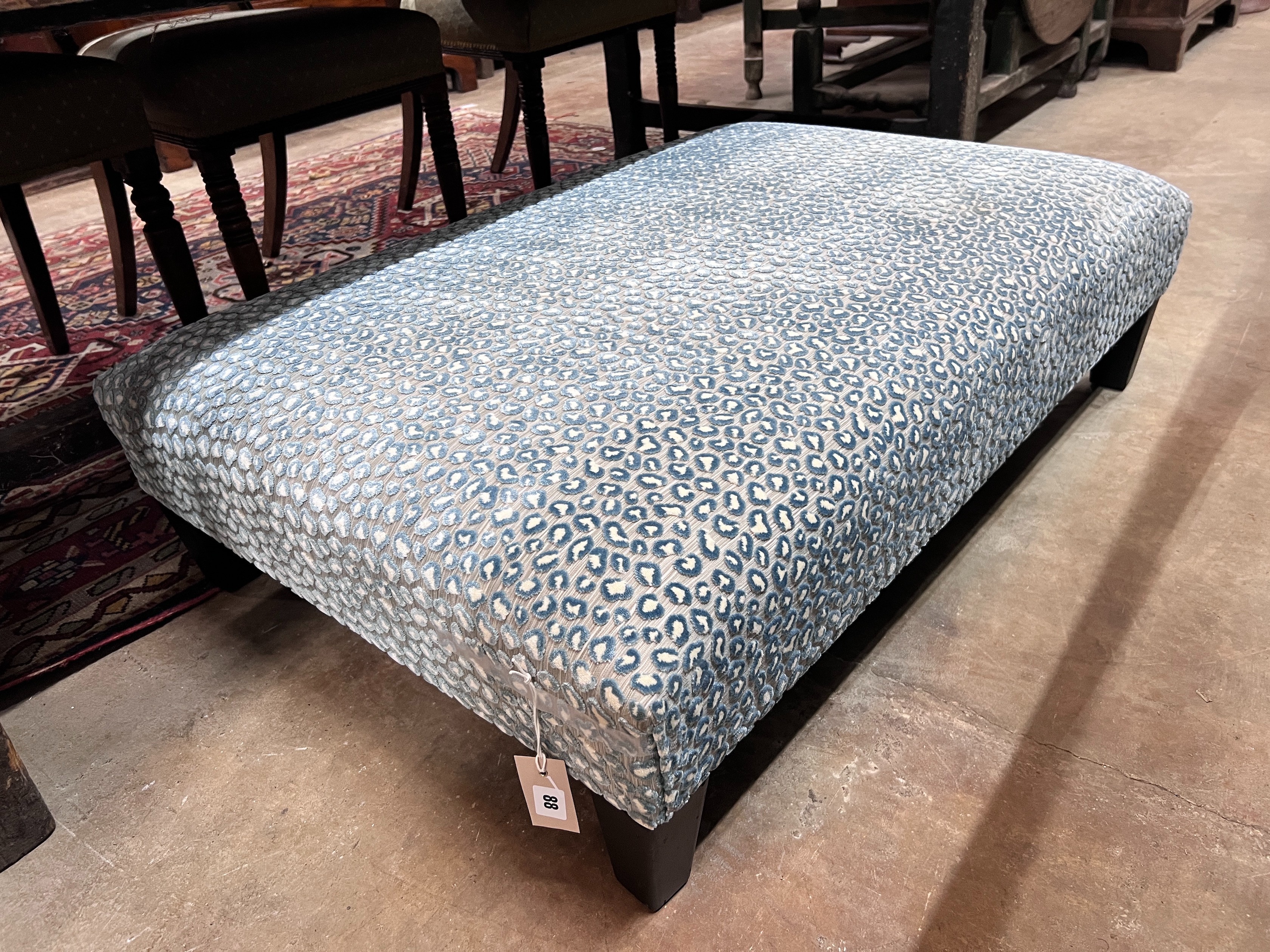 A Colefax & Fowler foot stool, length 103cm, depth 70cm, height 28cm *Please note the sale commences at 9am.